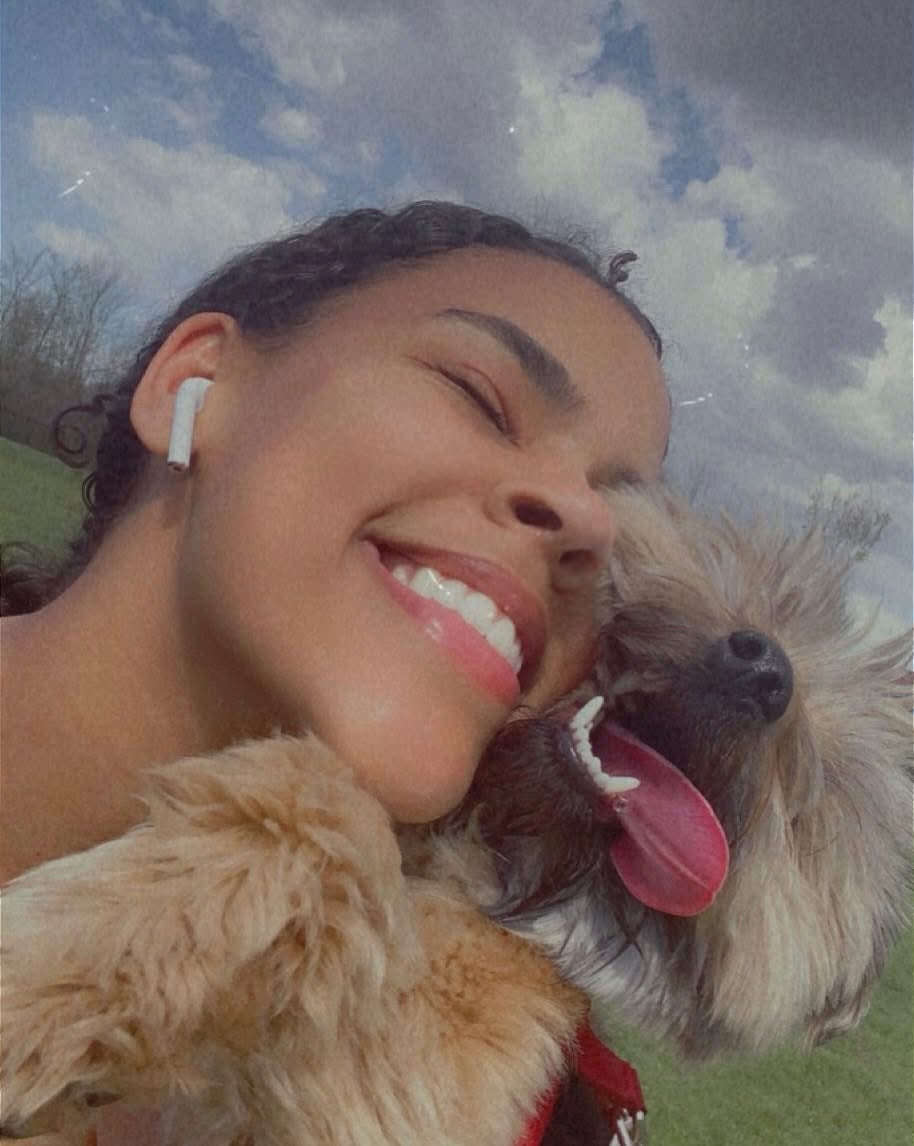 Courtney outdoors with her dog